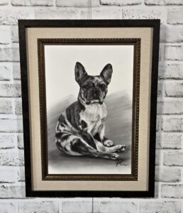 Black-and-white French Bulldog portrait artwork custom framed with a linen mat and dark wood moulding.